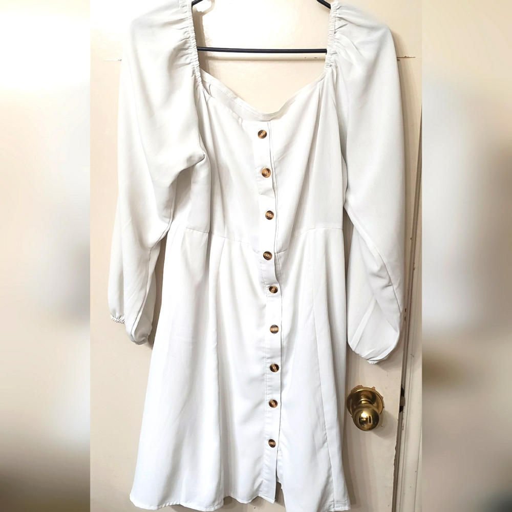 Off the shoulder white dress w/ brown button down buttons.